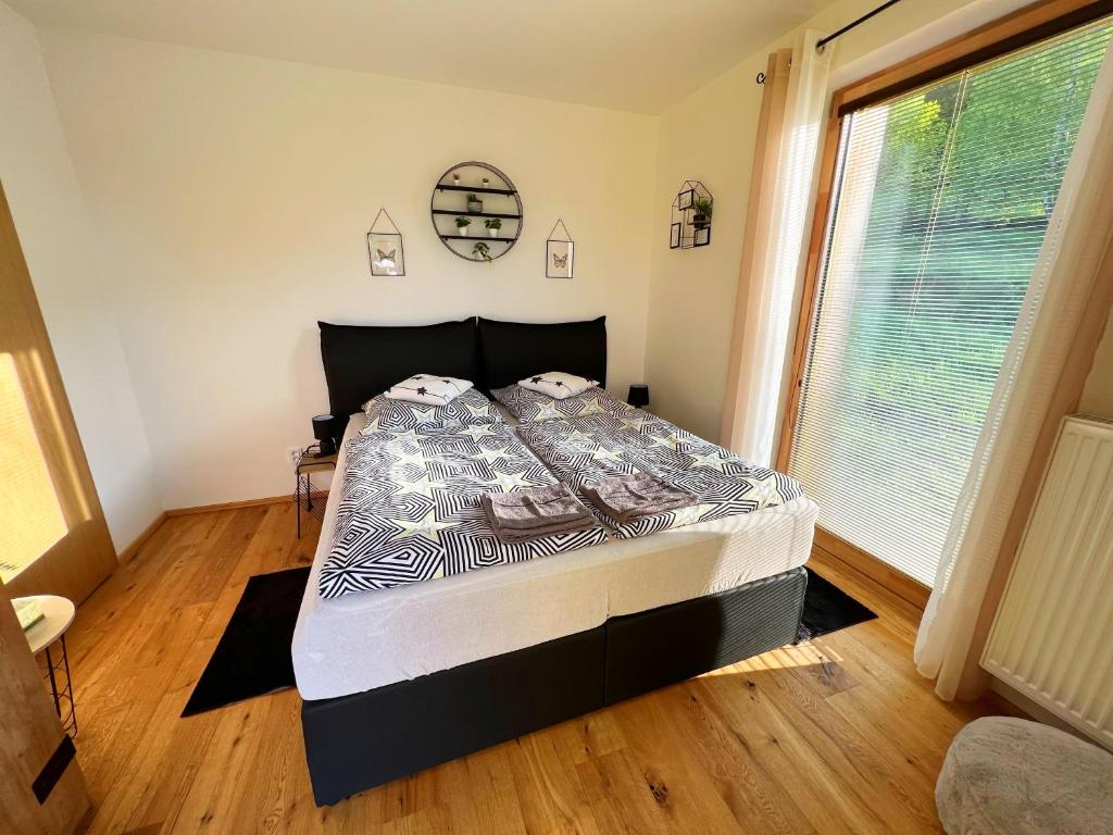 Postel nebo postele na pokoji v ubytování Apartmán NatEmi u sjezdovky Filipovice