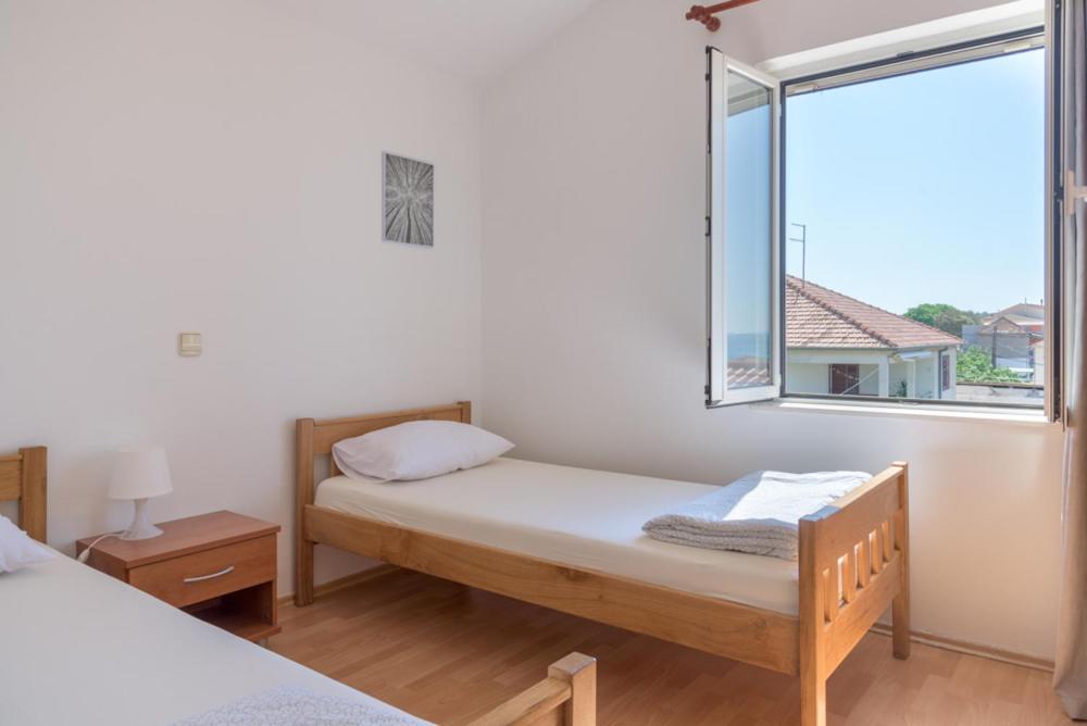 Postel nebo postele na pokoji v ubytování Rasin Apartments