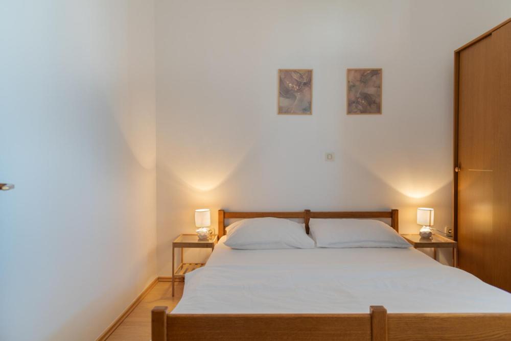Postel nebo postele na pokoji v ubytování Rasin Apartments