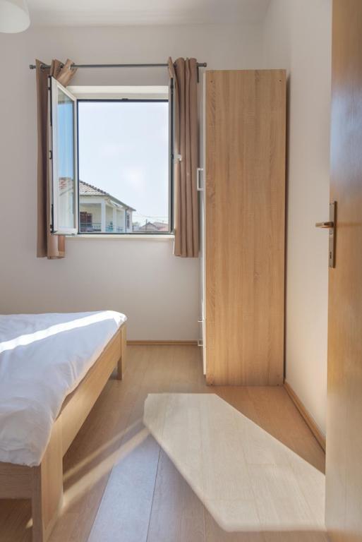 Postel nebo postele na pokoji v ubytování Rasin Apartments