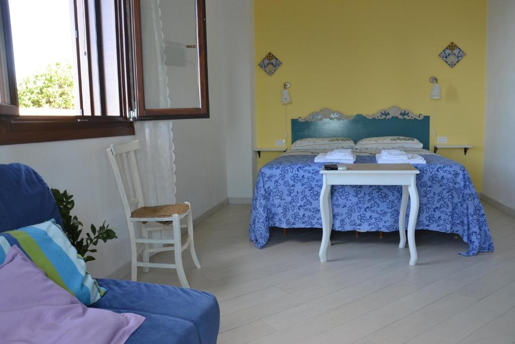 Postel nebo postele na pokoji v ubytování B&B Talìa