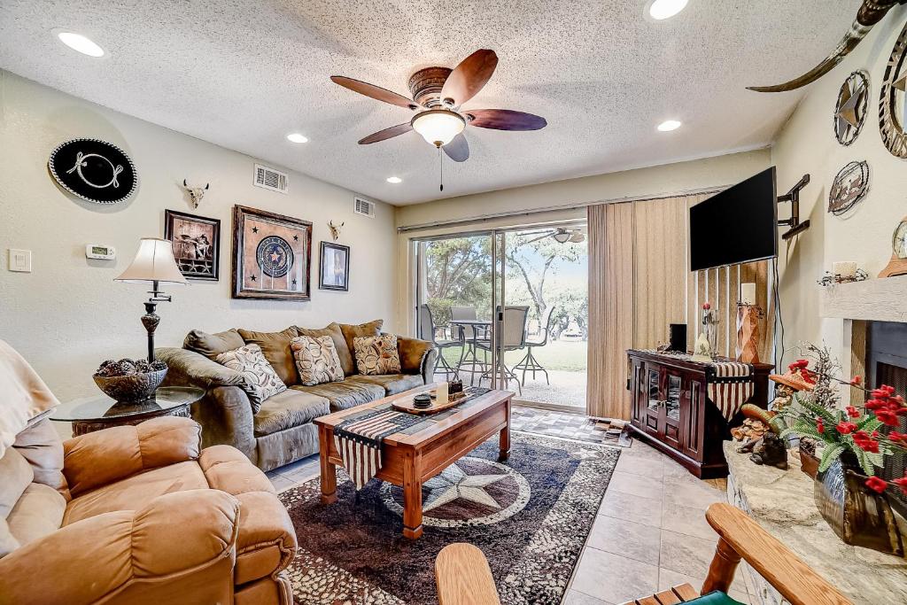 a living room with a couch and a table at 1185 Parkview Dr Unit 22 in Canyon Lake