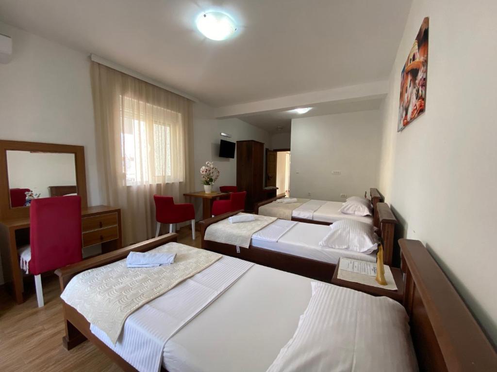 Postel nebo postele na pokoji v ubytování Robi Apartments