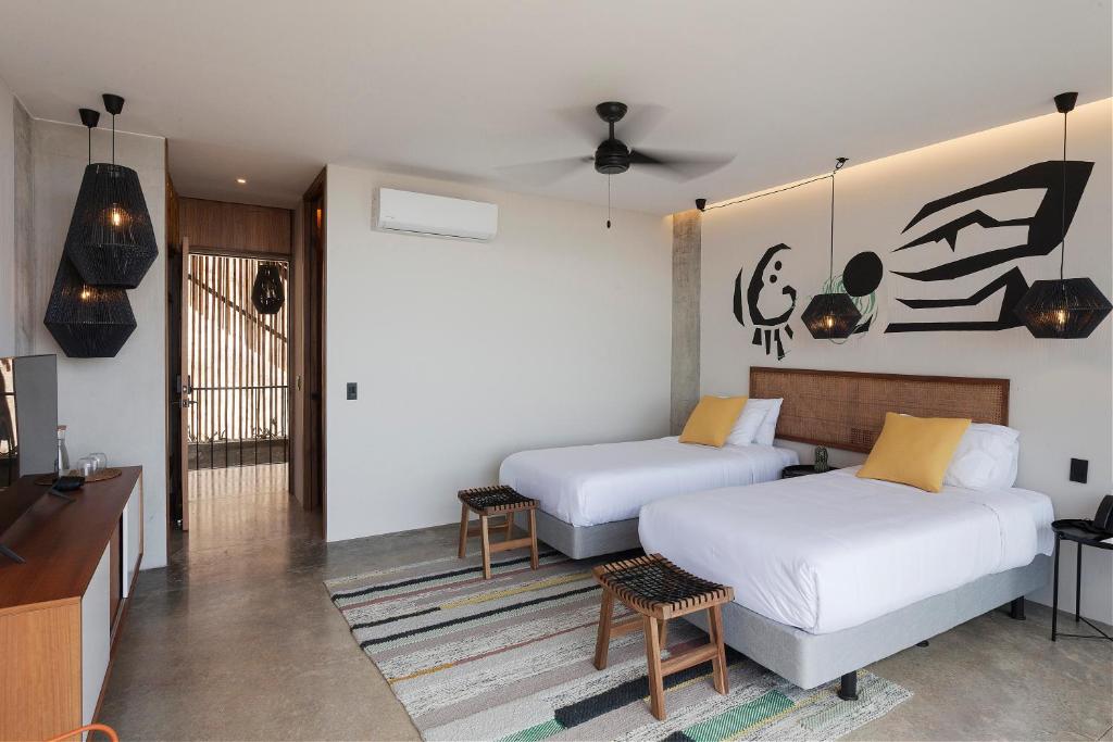 Postel nebo postele na pokoji v ubytování Eolia Sustainable Design Hotel