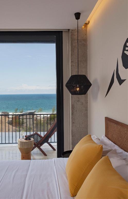 Postel nebo postele na pokoji v ubytování Eolia Sustainable Design Hotel