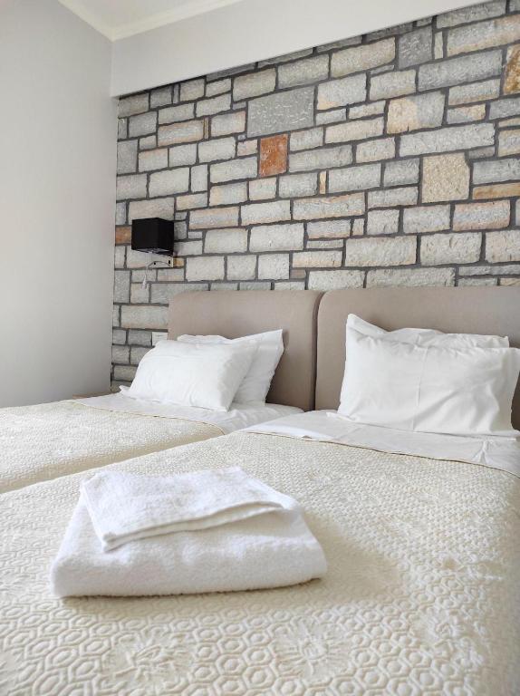Łóżko lub łóżka w pokoju w obiekcie Iris Villas Complex