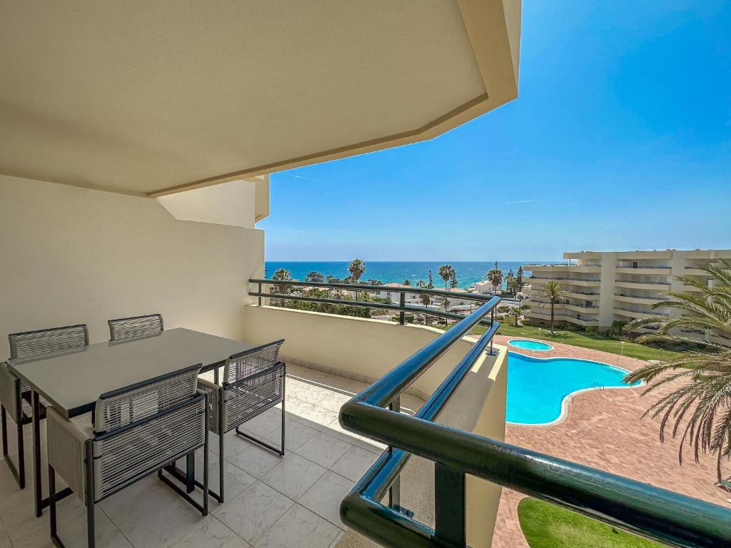 a balcony with a slide and a view of the ocean at Luxury Apart wStunning Sea Views, Walk Beach in Albufeira