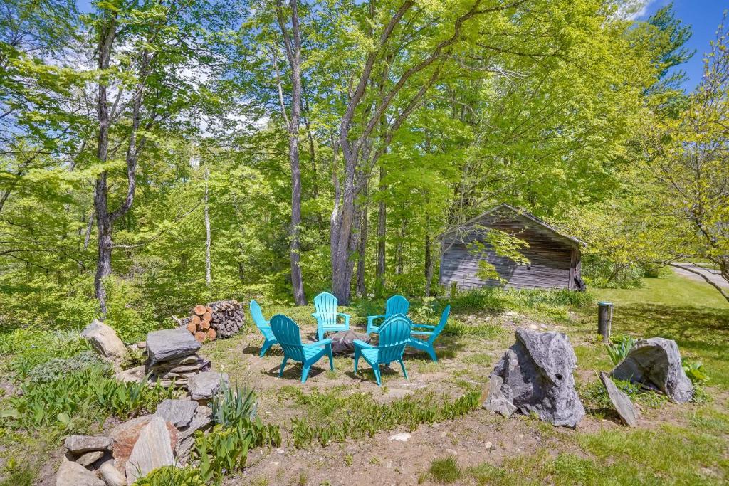 a group of chairs and a table in a yard at 12-Acre Vacation Rental in the Berkshires! in Hawley