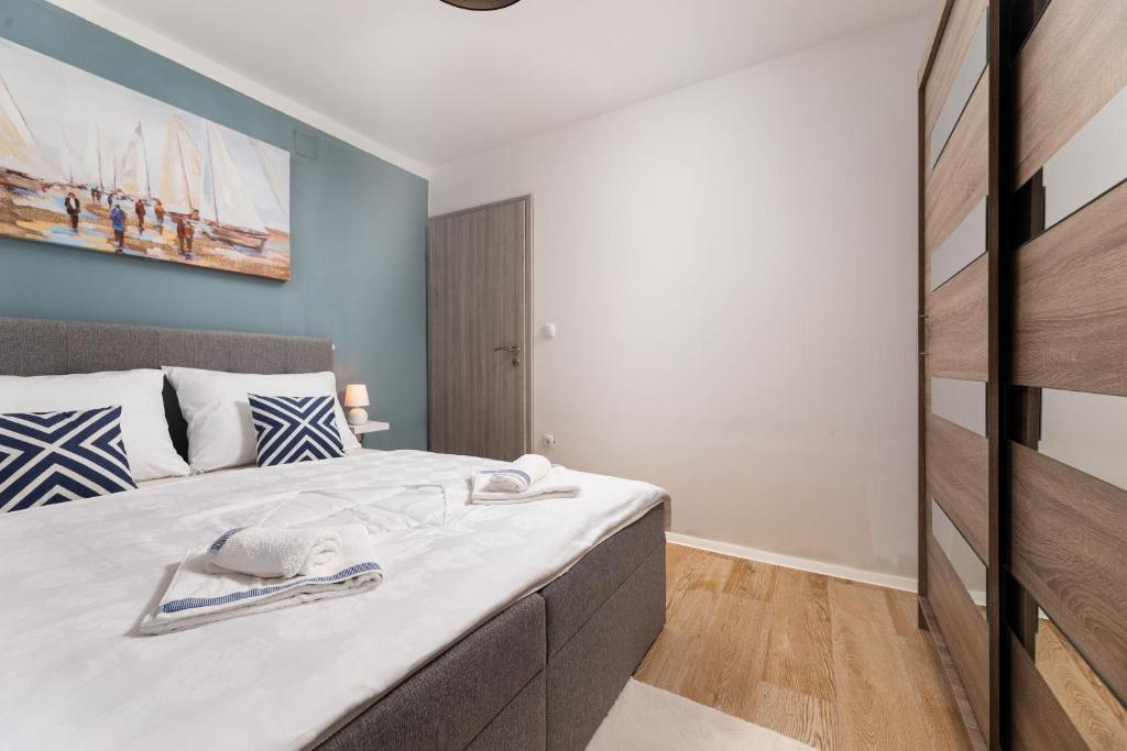 Postel nebo postele na pokoji v ubytování Apartments Vugrin