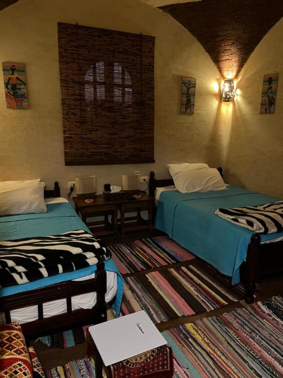 Cama ou camas em um quarto em Siwa Spot
