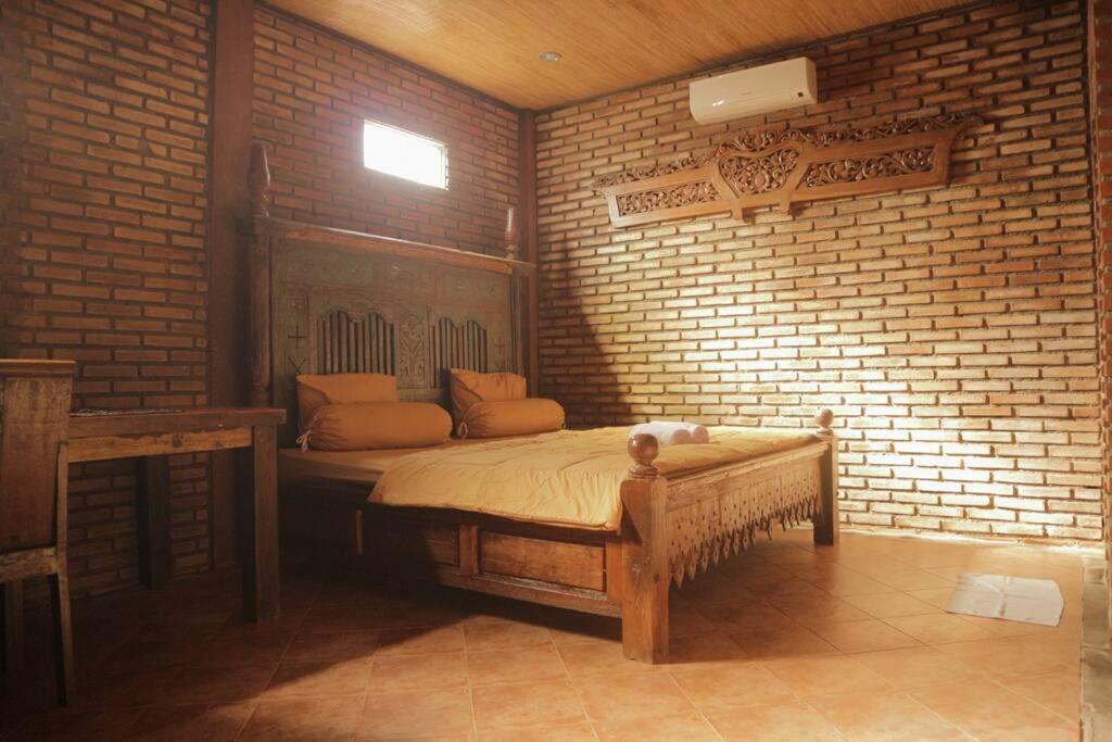 Tempat tidur dalam kamar di DIN HOUSE BALI Jimbaran
