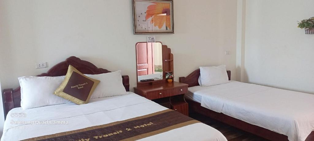 Postel nebo postele na pokoji v ubytování Family Transit 2 Hotel