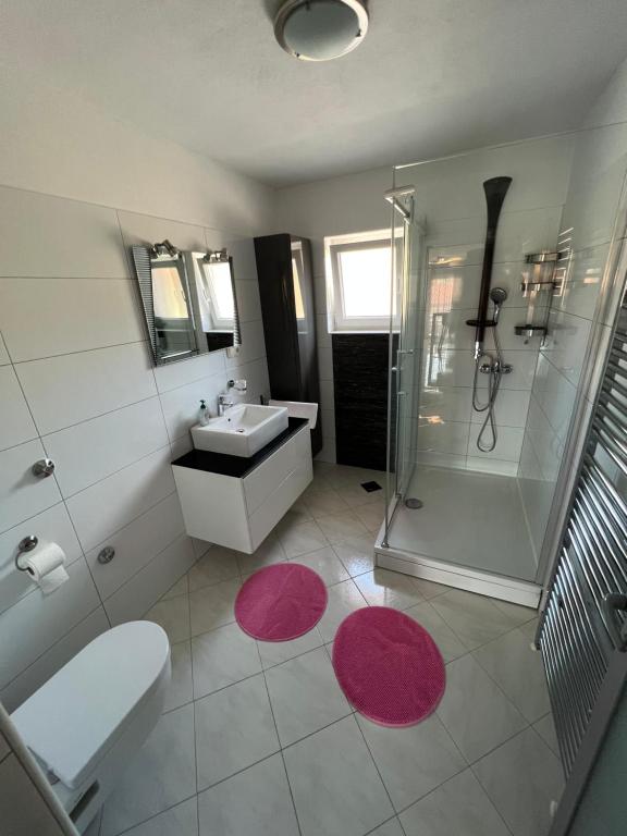 a bathroom with a sink toilet and a shower at Apartments Ćosić in Klenovica
