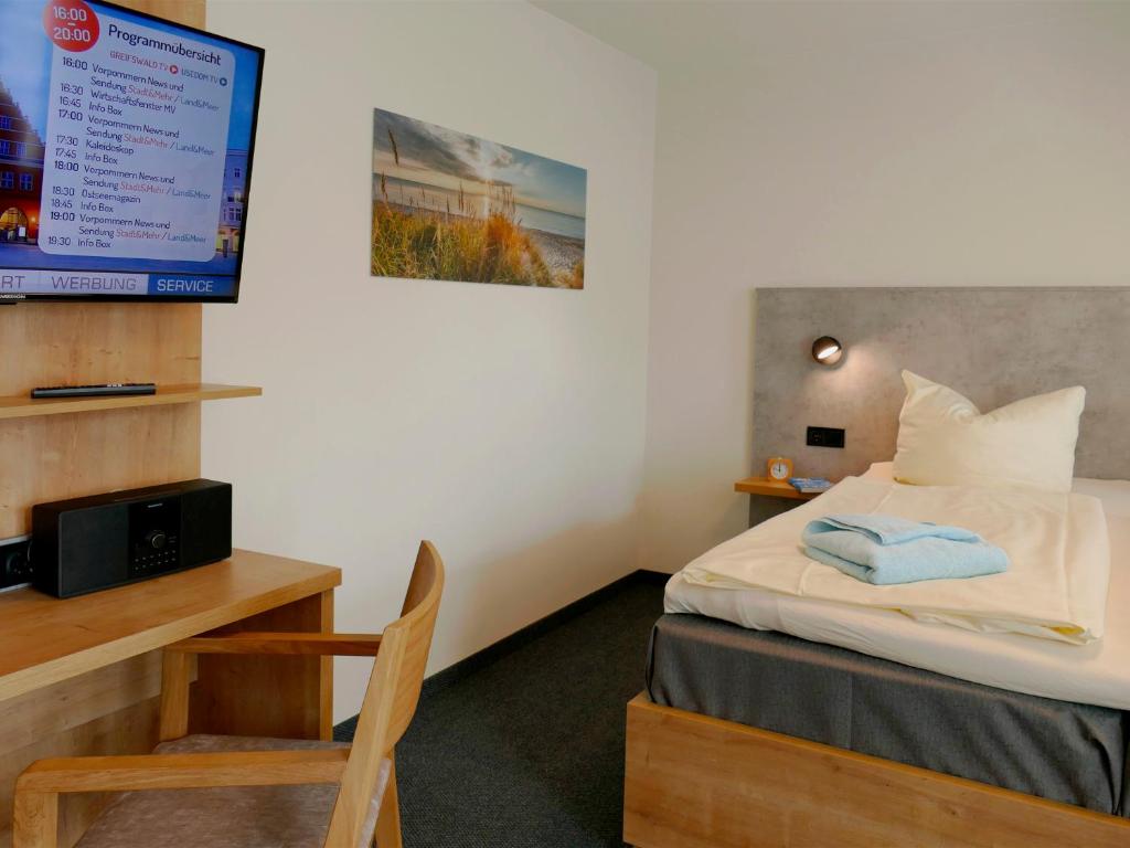 Postel nebo postele na pokoji v ubytování Pension Maiglöckchen