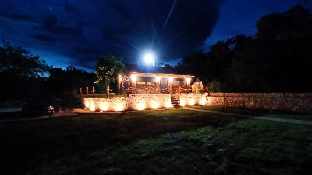 a house with a light on top of it at night at Stone House Montenegro in Danilovgrad