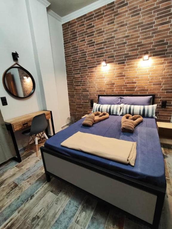 Łóżko lub łóżka w pokoju w obiekcie Grecos STAY SKIATHOS