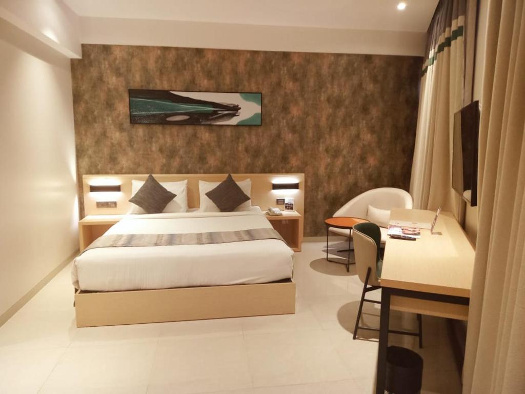 Postel nebo postele na pokoji v ubytování Click Hotel Bangalore - International Airport