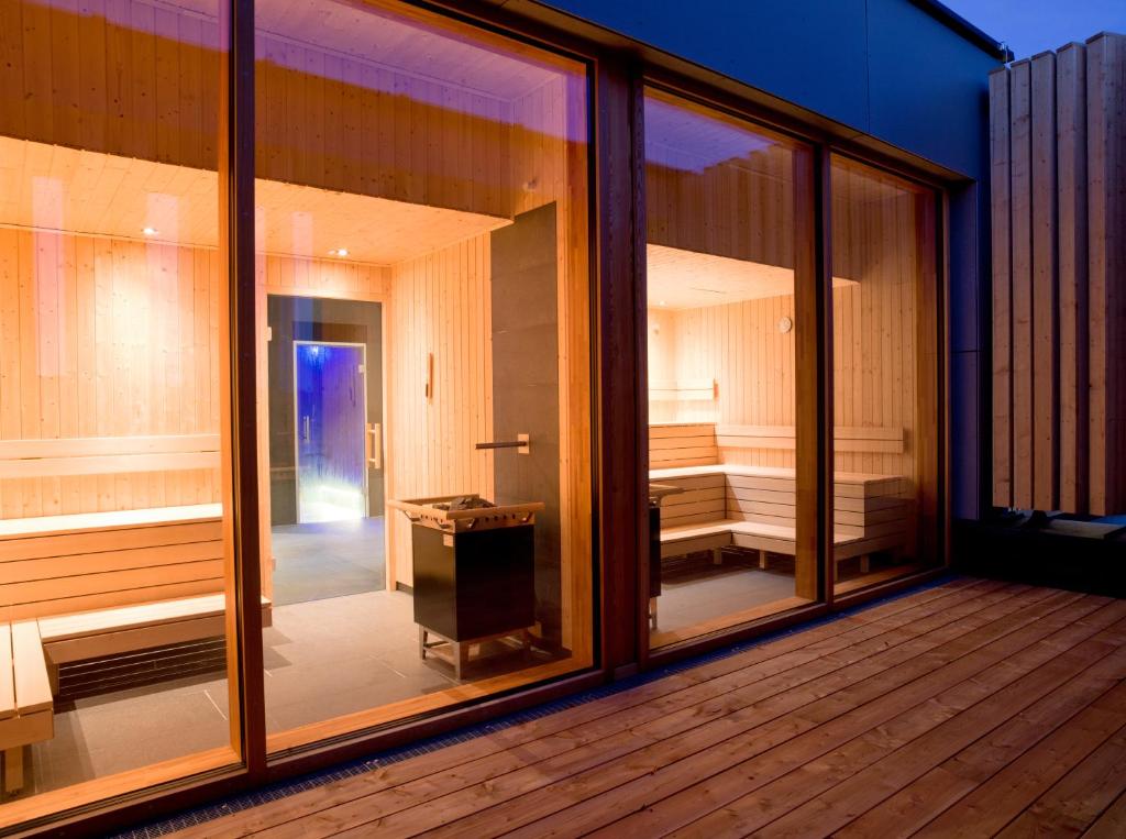 Postel nebo postele na pokoji v ubytování Naturhotel & Chalets Euler