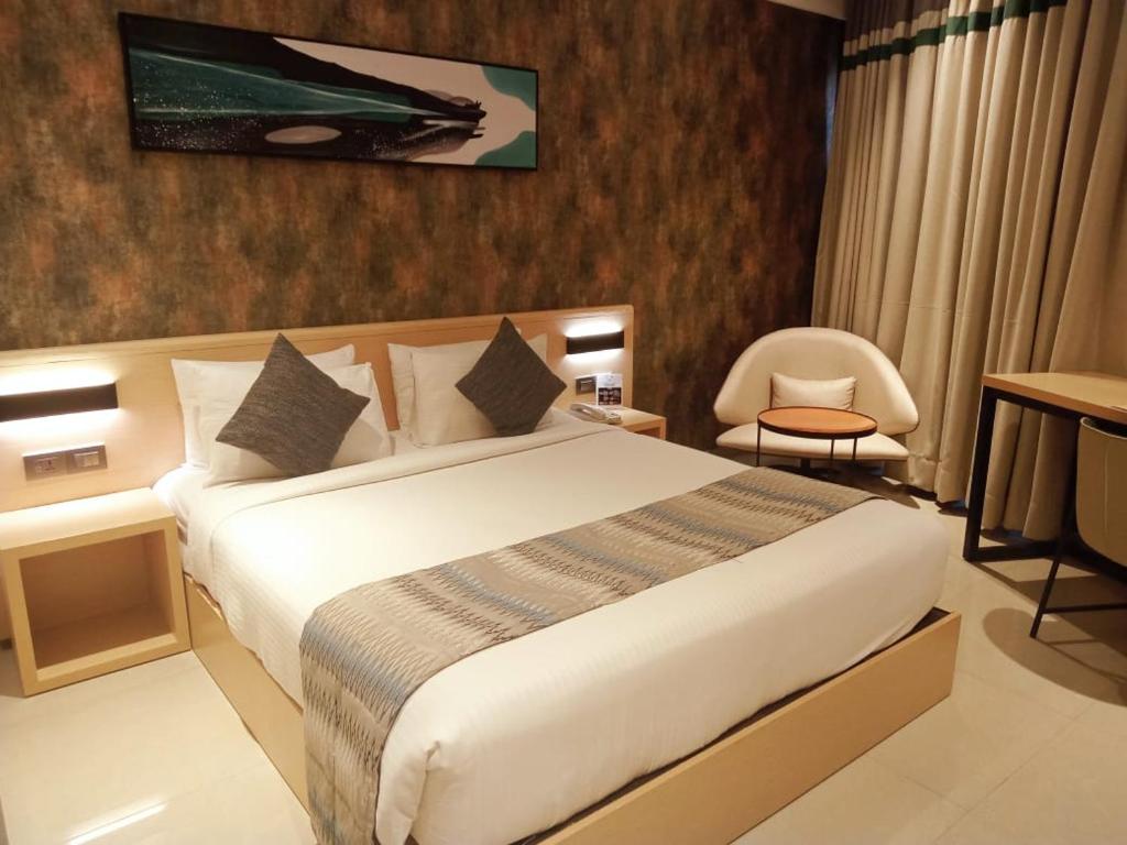 Postel nebo postele na pokoji v ubytování Click Hotel Bangalore - International Airport