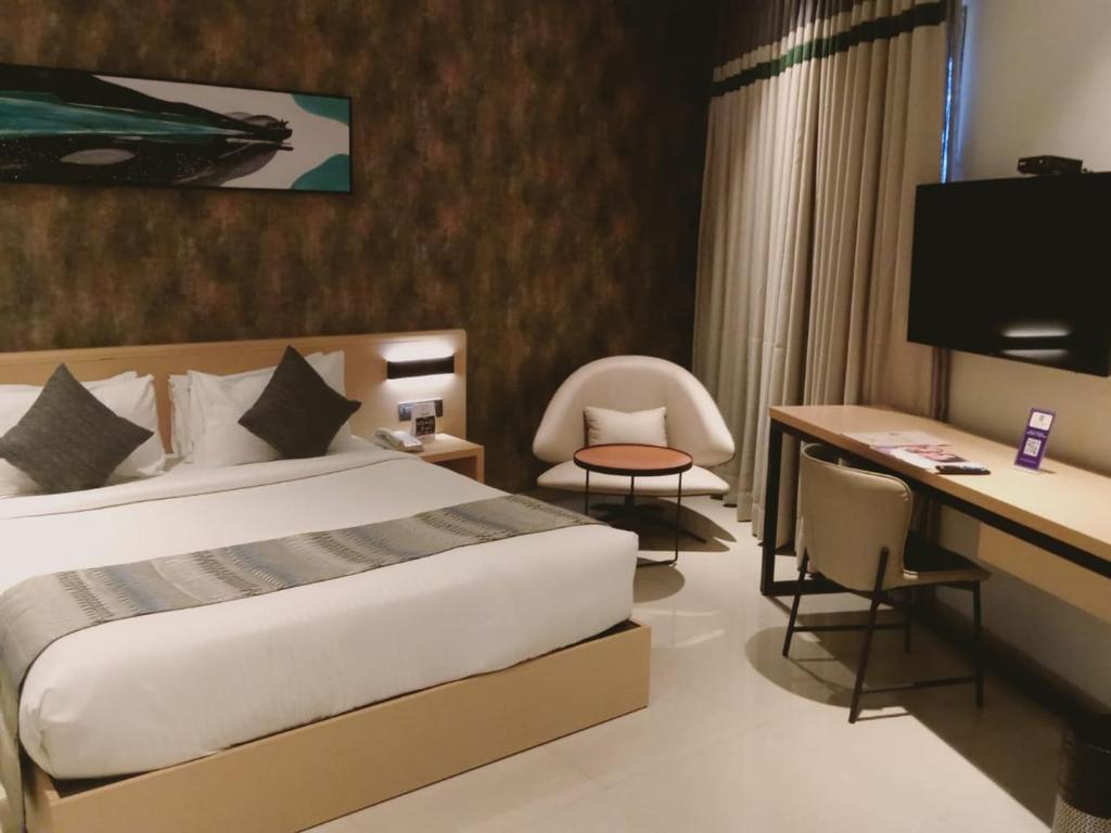Postel nebo postele na pokoji v ubytování Click Hotel Bangalore - International Airport