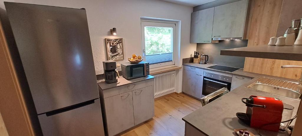 Kuchyň nebo kuchyňský kout v ubytování Haus Tirol Appartements