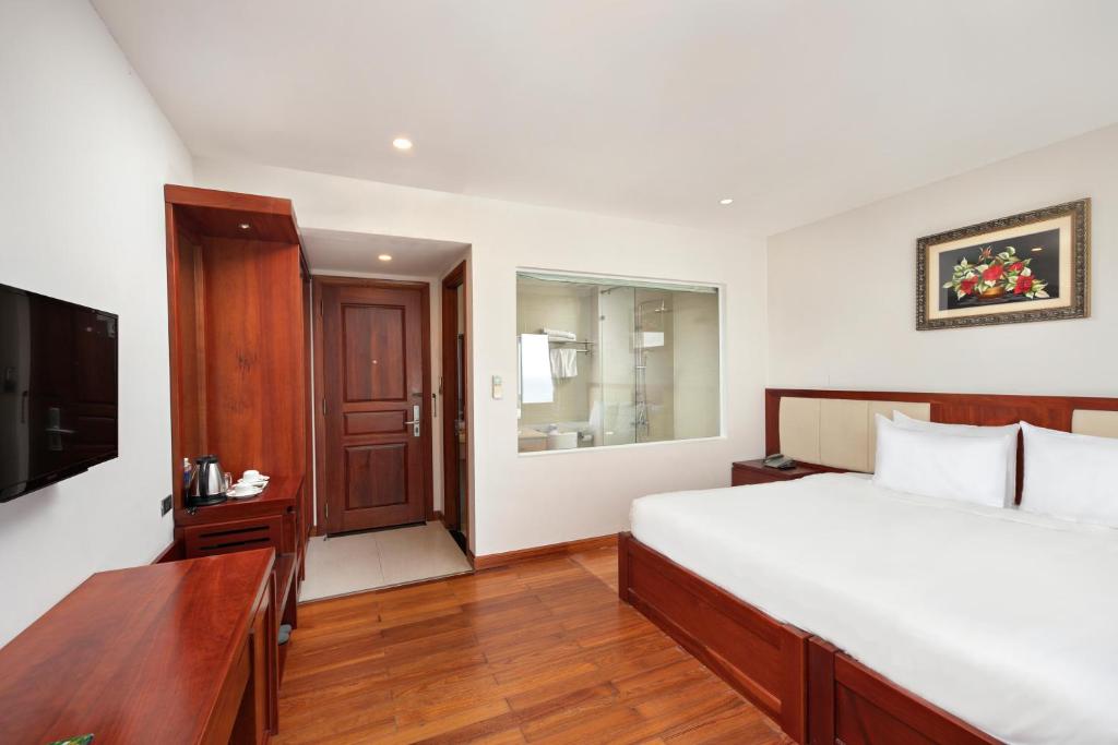 Giường trong phòng chung tại Sekong Hotel Da Nang