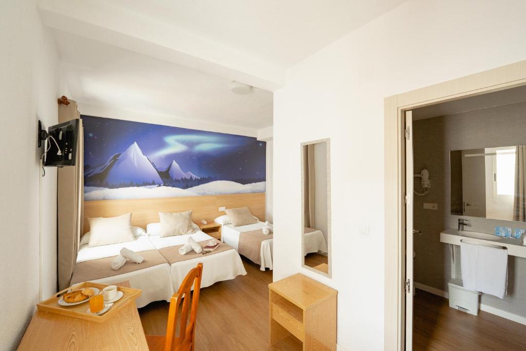 Postel nebo postele na pokoji v ubytování Hotel Internacional
