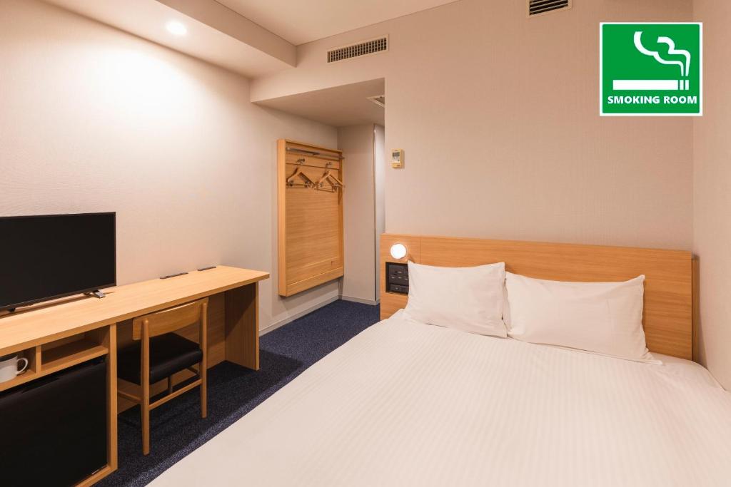 Postel nebo postele na pokoji v ubytování Sotetsu Fresa Inn Tokyo-Akasaka