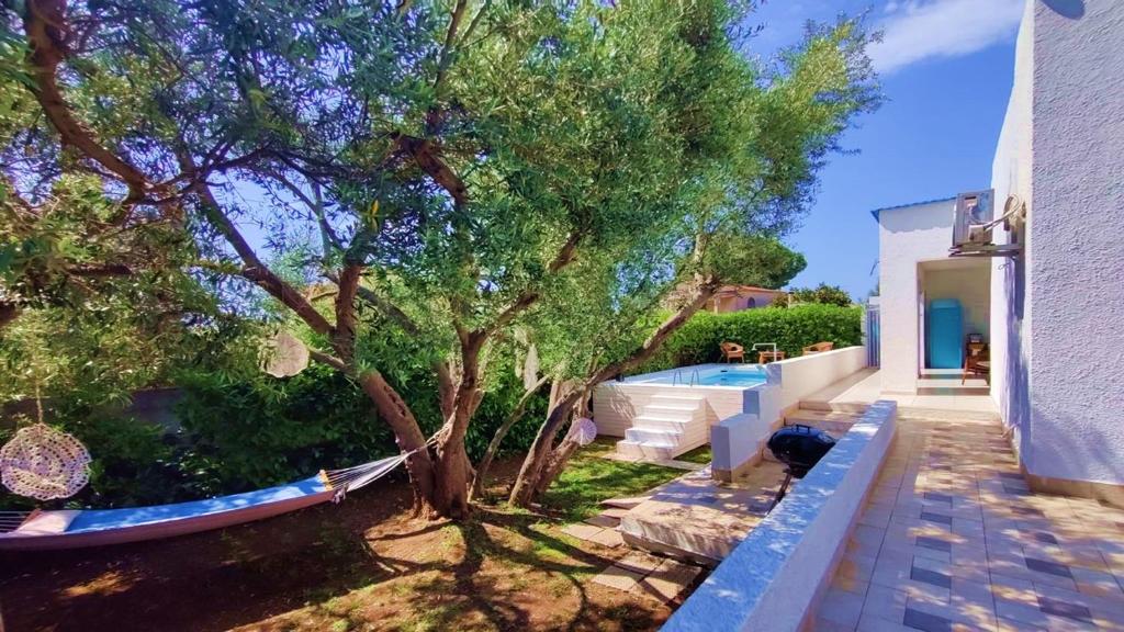 Сад в Pool Seaside Relais - VILLE Ninfea, Marea, Rosa e Cassiopea