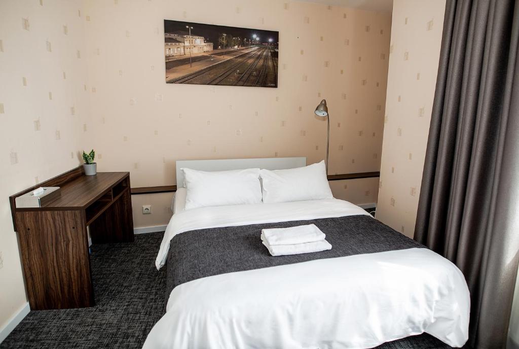 Postel nebo postele na pokoji v ubytování Hotel Tomas