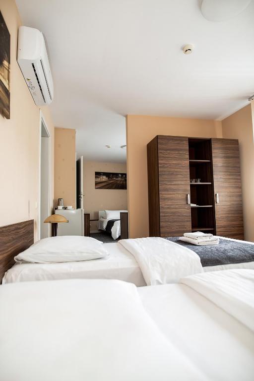 Postel nebo postele na pokoji v ubytování Hotel Tomas