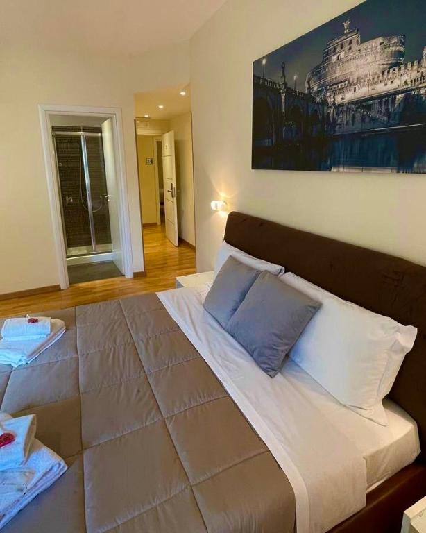 A bed or beds in a room at Rienzo Vatican Suites