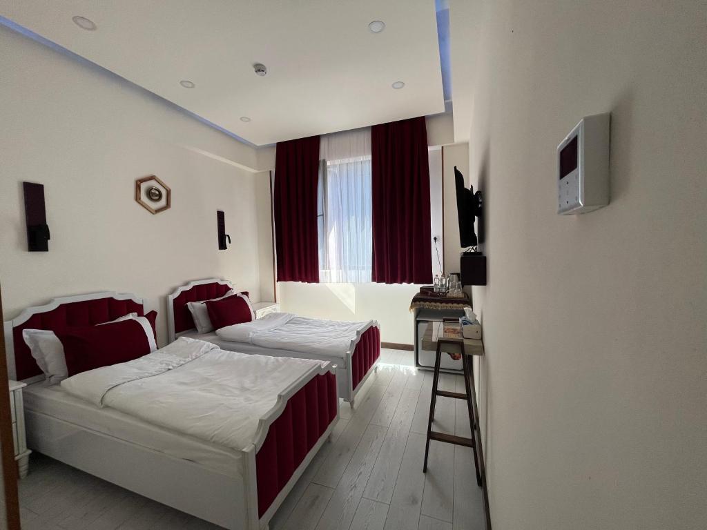 Postel nebo postele na pokoji v ubytování LUXIN