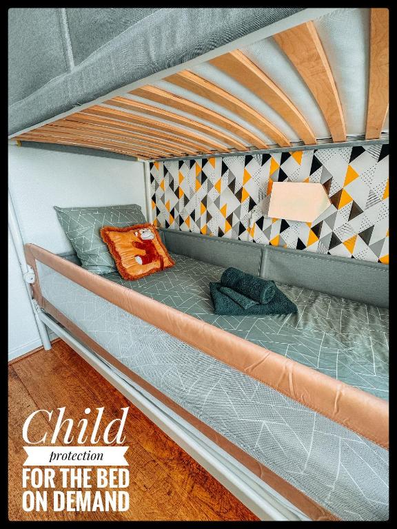 a bed on a bunk bed on a bunk bed frame at CASA MARE hartje Oostende met gratis parking in Ostend