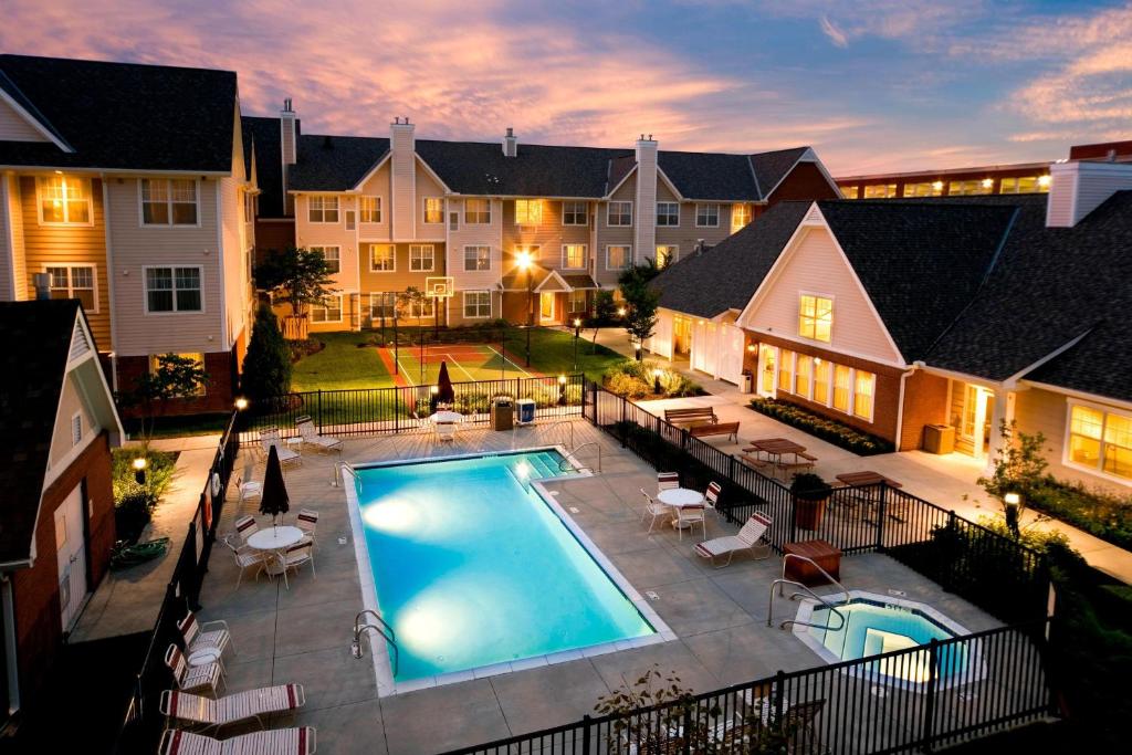 an aerial view of a house with a swimming pool at Residence Inn Columbus Easton in Columbus