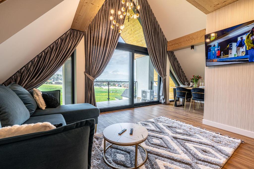 TV a/nebo společenská místnost v ubytování Góralski Resort Pool & SPA