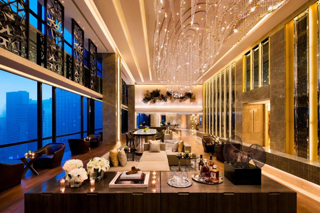 a living room with a couch and a table at JW Marriott Hotel Chengdu in Chengdu