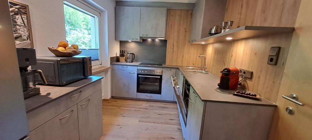 Kuchyň nebo kuchyňský kout v ubytování Haus Tirol Appartements