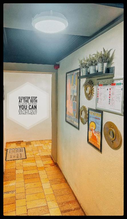 a room with a wall with a sign on it at CASA MARE hartje Oostende met gratis parking in Ostend