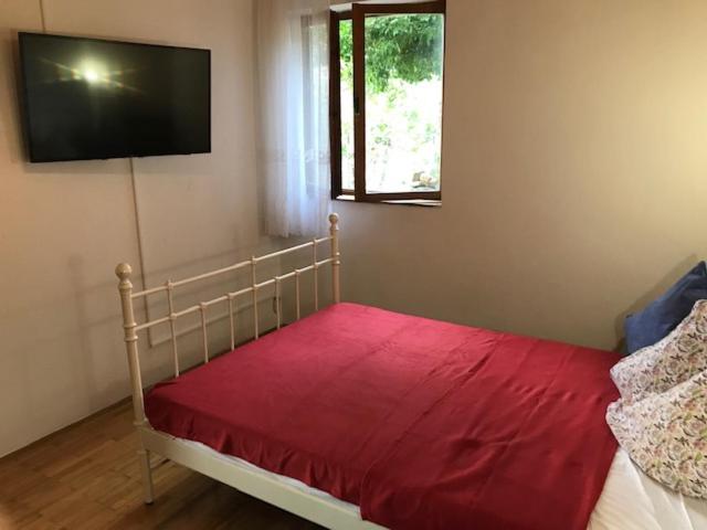 Postel nebo postele na pokoji v ubytování Apartments Stokic