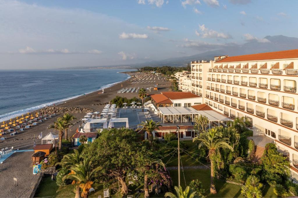 an aerial view of the hotel and the beach at Delta Hotels by Marriott Giardini Naxos in Giardini Naxos