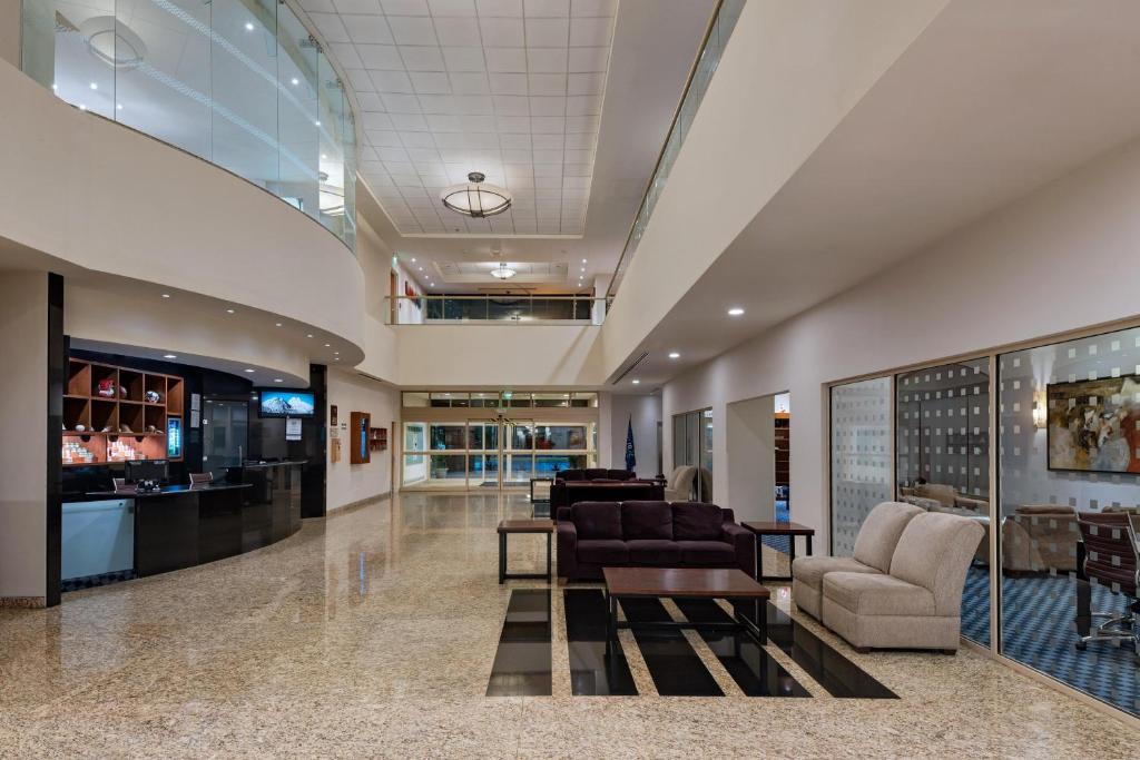 a lobby with couches and chairs in a building at Four Points by Sheraton Monterrey Linda Vista in Monterrey