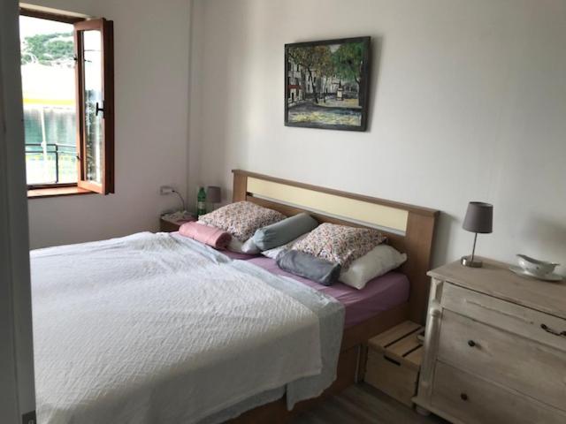 Postel nebo postele na pokoji v ubytování Apartments Stokic
