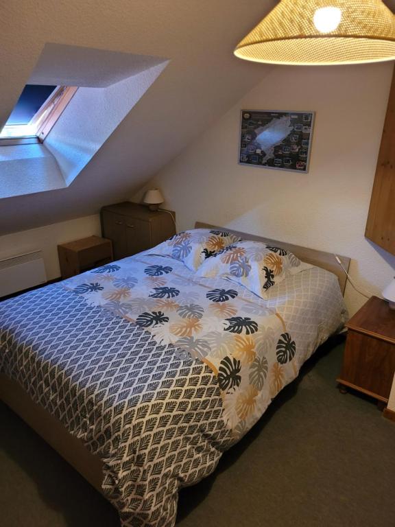 Postel nebo postele na pokoji v ubytování Duplex Métabief