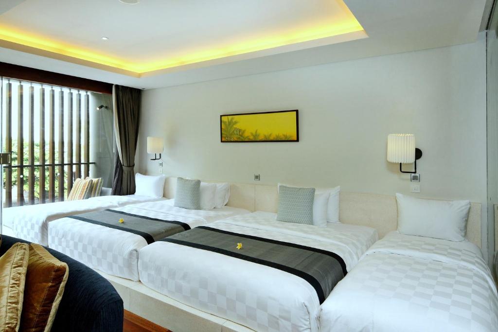 Postel nebo postele na pokoji v ubytování Watermark Hotel & Spa Bali