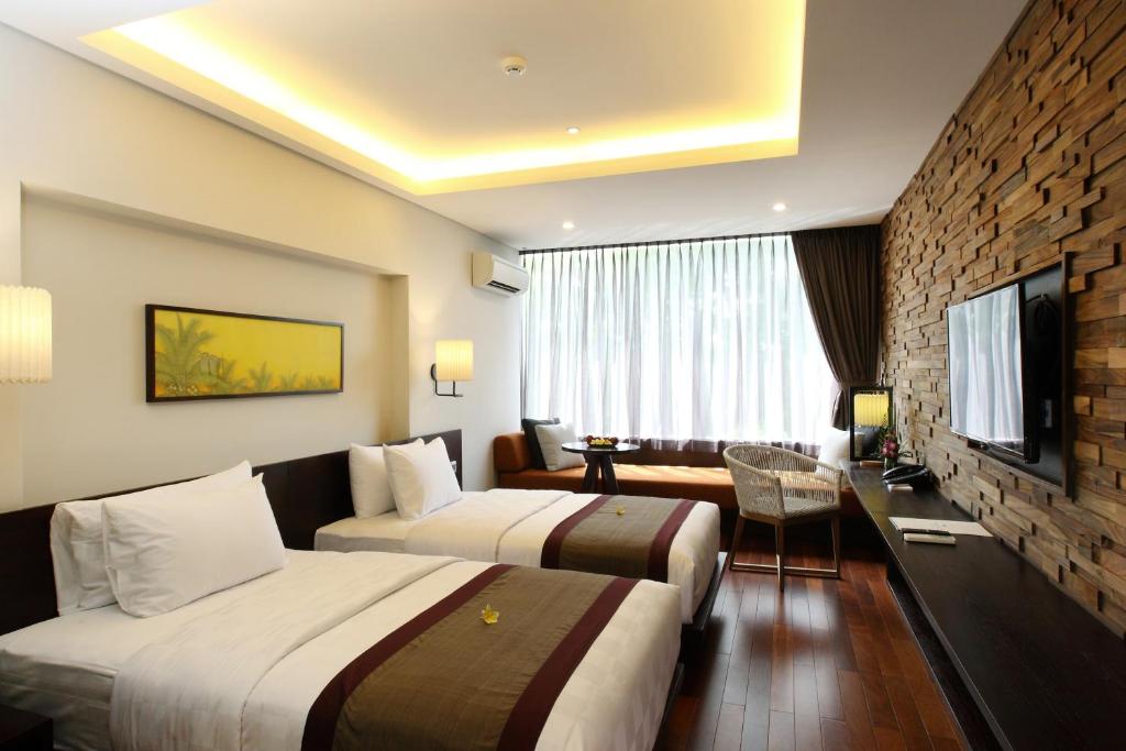 Postel nebo postele na pokoji v ubytování Watermark Hotel & Spa Bali