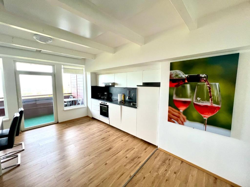 a living room with a wine glass on the wall at Schilcherland Lodge in Greisdorf