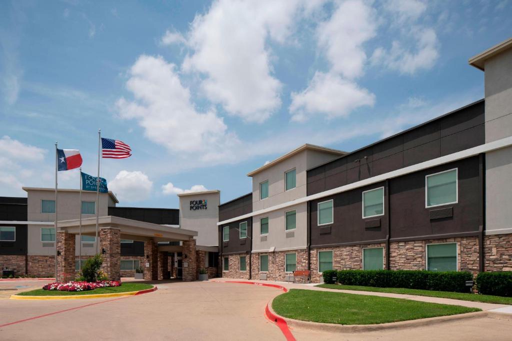 an image of the front of a hotel at Four Points by Sheraton Dallas Arlington Entertainment District in Arlington