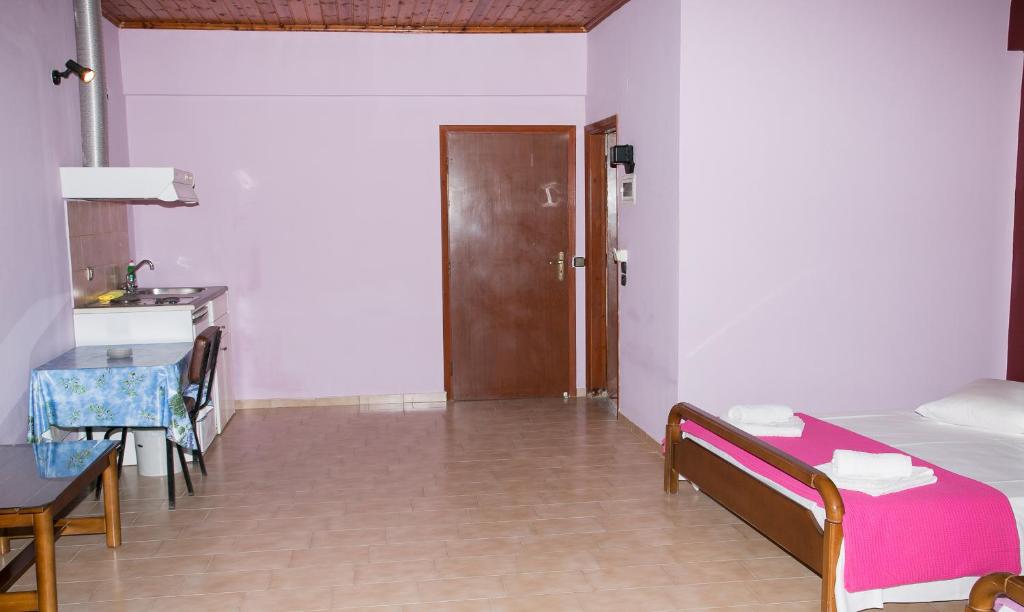 Postel nebo postele na pokoji v ubytování Petania Hotel & Apartments