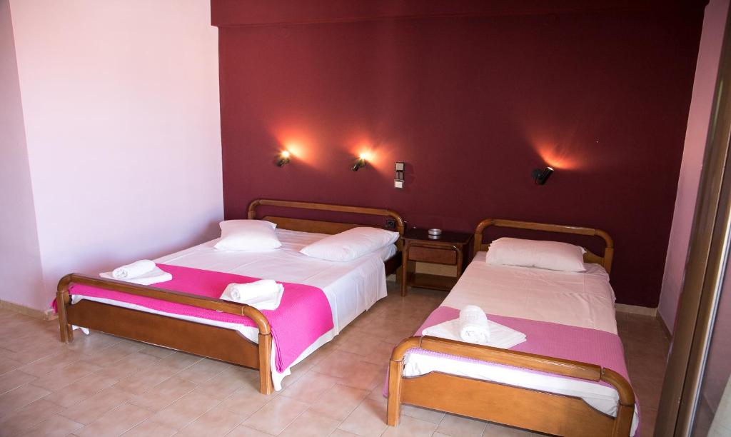 Postel nebo postele na pokoji v ubytování Petania Hotel & Apartments